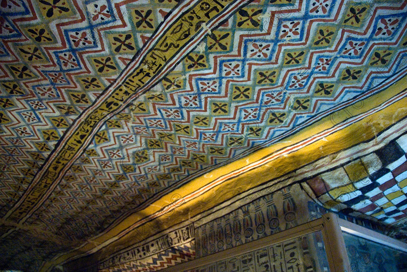 Sennufer Tomb Ceiling EG075669JHP 
 Luxor Nobles Egypt Sennefer Tomb Painting Ceiling Mat Colors Pattern Zigzag, one of many beautifully decorated tombs amongst the Tombs of the Nobles on the West Bank of the River Nile at Luxor here with its extensive almost complete painted ceiling. Sennefer [Tomb 96] was Major of the Southern City in Dynasty XV111 during the reign of Amenhotep 11. The area has been greatly improved with removal of many of the old modern houses and entry to these fascinating burial sites made more accessible. 
 Keywords: Egypt, Luxor, Tombs, Nobles, Thebes, River Nile, West Bank, Old Qurna, Sheikh Abd’el-Qurna, landscape, Mayor, Sennefer, tomb, painting, colourful, colorful, colours, colors, painted, ceiling, patterns frieze, artificial, light, digital