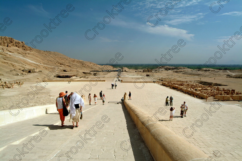 Hatshepsut Temple EG02140JHP 
 Hatshepsut Temple Luxor fertile land West Bank Nile vista stairs view coming down from the Upper or central court was opened again in 2002 and makes the visit to this magificent temple almost complete except that entrance into the burial chmaber itself is restricted and leaving one has this vista to the River Nile and the West Bank. This magnificent mortuary temple is located on the West Bank of the River Nile at Luxor at an area called Deir el-Bahri and built into the base of the cliffs of the Theban Hill behind which are branches of the Valley of the Kings. 
 Keywords: Egypt, Luxor, Thebes, Theban, West Bank, Deir el-Bahri, el-Bahari, Dayr, Hatshepsut, mortuary, Temple, landscape, vista, upper, central, court, statues, archaeology, ancient, Egyptian, history, Egyptology, Consort, Queen, Pharaoh, Royal, ruler, woman, columns, hall