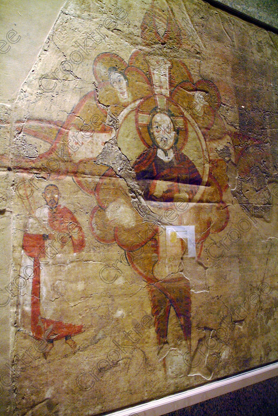 Aswan Nubian Museum Painting EG052976JHP 
 Aswan Egyptian Nubian Museum early Christian wall fresco exhibited in this modern building whose foundations were laid in 1986, opened in 1997 and organised through UNESCO. Very low artificial light makes general photography difficult as well as affecting accurate colour balance. This now appears to be the only museum in Egypt where photography is still allowed although it is not easy as the ambient lighting is extremely subdued for conservation reasons. 
 Keywords: Egypt, Egyptian, Aswan, Nubian, Nubia, Museum, exhibit, Christian, wall, painting, fresco, cross, religious, religion, symbolism, inside, interior, upright