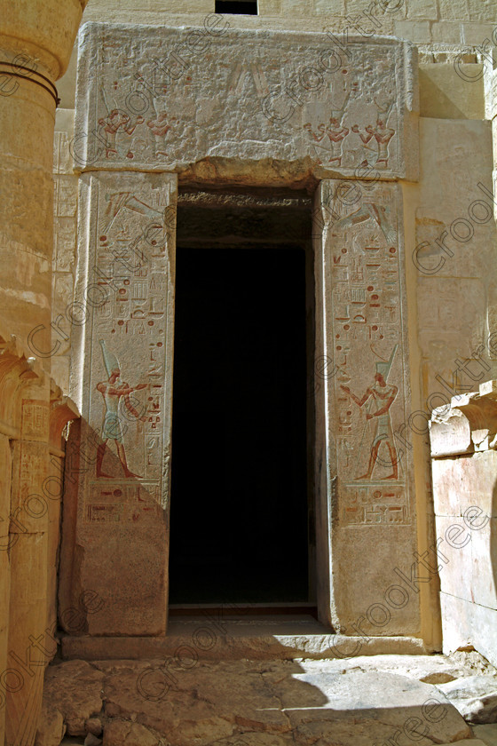 Hatshepsut Temple EG02124JHP 
 Hatshepsut Temple Egyptian Style Doorway Sanctuary Amun Painted Figures Gods Upper or central court was opened again in 2002 and makes the visit to this magificent temple almost complete except that entrance into the burial chmaber itself is restricted, photographed here through the gate. This magnificent mortuary temple is located on the West Bank of the River Nile at Luxor at an area called Deir el-Bahri and built into the base of the cliffs of the Theban Hill behind which are branches of the Valley of the Kings. 
 Keywords: Egypt, Luxor, Thebes, Theban, West Bank, Deir el-Bahri, el-Bahari, Dayr, Hatshepsut, mortuary, Temple, upright, upper, central, court, burial, chmaber, entrance, statues, archaeology, ancient, Egyptian, history, Egyptology, Consort, Queen, Pharaoh, Royal, ruler, woman, columns