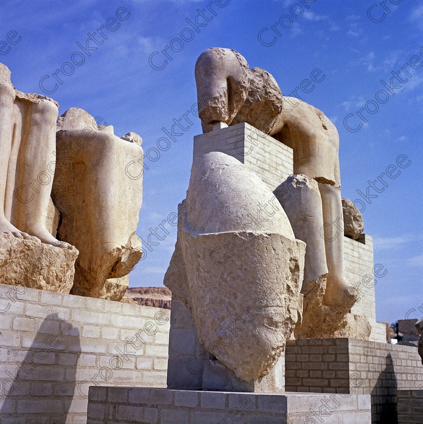 Merneptah Museum EG05144jhp 
 Egyptian Temple Luxor Merneptah open air museum exhibits square format West Bank, an Egyptian Pharaoh who reigned around 1212-1202BC, son of Ramasses 11, is on the West Bank of the Nile at Luxor and this photo was taken in the open air museum as part of the partially restored temple layout. A new museum and some excavated parts of his temple were opened in 2005. It is a mixture of open air and covered museum exhibits with some remains of the temple area with column bases. Some of the coloured wall reliefs are exquisite and because of the natural light available were easily photographed despite being inside. There is also a replica of the famous Israeli Stele, the original being in the Cairo Museum. This is a visit that would have to made outwith the usual West Bank package tour although easily arranged and is easily found next to the Ramasseum. 
 Keywords: Egypt, Luxor, Thebes, West, Bank, River, Nile, temple, mortuary, Qurna, Merneptah, Merenptah, pharaoh, 1212BC, landscape, upright, mudbrick, pylon, ruins, walls, foundations, history, ancient, Egyptian, antiquity, archaeology, Egyptology, restoration, excavation, museum, wall, reliefs, paintings, colourful, colorful, colours, colors, evening, light, fertile, crops, roadside, view, Ramasseum, Ramses, son, Ramasses, May, 2005, slide, film, Fuji, RDP 111, Provia, 6x6, 120, medium, square, format, Yashica, Mat 124G, scanned, scan