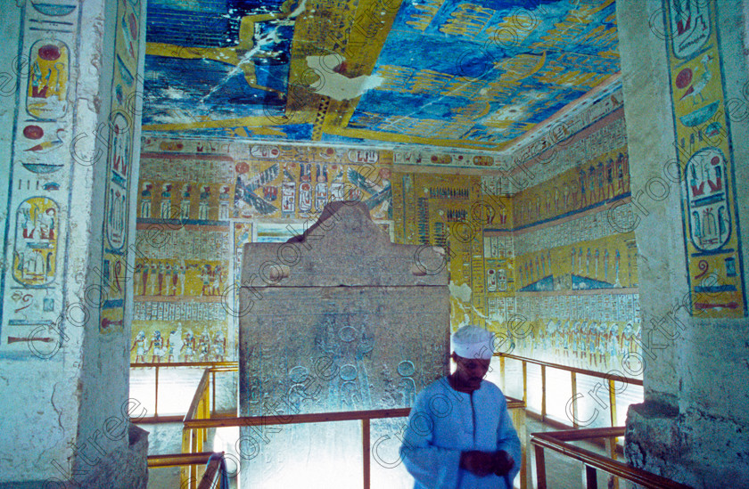 Tomb Ramasses IV EG017122JHP 
 Tomb Ramasses Valley Kings Thebes Chamber Egyptian Custodian Painting Colours on the West Bank of the River Nile at Luxor, the ancient Egyptian capital city of Thebes and is a spectacular example of true majesty with scale, colour and elaborate craftsmanship carved out of solid rock. This was the only opportunity I had of using a tripod, special ticket available in 2001 and I had a roll of tungsten artificial light balanced slide film which allowed long exposures and a decent depth of field. The custodians could not have been more helpful and even cleared areas for me to photograph free of visitors but oh for my D700 DSLR. 
 Keywords: Egypt, Luxor, West Bank, Thebes, Valley, Kings, Ramses, Ramasses, Ramesses, 1V, tomb, interior, inside, landscape, custodian, turban, galabea, ancient, Egyptian, archaeology, Egyptology, tungsten, slide, scanned, burial, Nut, nightsky, sarcophagus, granite, chamber, hieroglyphs, coloured, colored, colourful, colorful, colours, colors, painted, ceiling, stars, spells