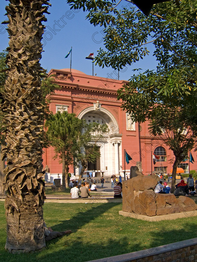 Cairo Egyptian Museum EG072607JHP 
 Egyptian Museum Cairo seats exhibits palm trees gardens entrance in the prime antiquities collection in Cairo taken during visits between 1994 and 1996 when photography was allowed albeit without flash and tripod. None is of studio quality, being handheld with existing, usually extremely poor light and using slide film, pushed Fuji 400asa to get a suitable aperture and shutter speed. Most of the photos are from the Tutankahum exhibits while the rest are items that interested me as I explored this wonderful and extensive collection, requiring many more hours if not days and is only hinted at during the usual one or two hour visit made on a package tour. 
 Keywords: Egypt, Cairo, Egyptian, Museum, Mariette, entrance, front, collections, upright, ancient, antiquity, antiquities, exhibits