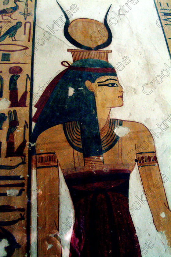 Valley Kings EG0213046jhp 
 Egypt Luxor Tomb KV19 Prince Mentuherkhepshef Isis Goddess solar disk painting colours was son of Ramasses 1X, but his tomb was unfinished but has some excellent colourful depictions of the important ancient Egyptian Gods and although protected by Perspex panels, the custodian was very helpful and slid them back for me to take photographs in 2002 when it was still allowed. Thanks to the capability of the modern digital camera, the first and only chance I have had to use one, a Fuji S2 as photography is now banned in the Valley of Kings per se and especially in the tombs. Adjustments in Photoshop give the chance of reasonably accurate colours even when the tomb paintings were lit by low level artificial light when tripods and flash were not allowed; what could I get with a Nikon F700 and a tripod, which were allowed at one time as well. 
 Keywords: Egypt, Luxor, West Bank, Thebes, Theban, Valley Kings, prince, tomb, KV19, Montu, Mentuherkhepshef, Montu-hir-Khopshef, Isis, Goddess, upright, paintings, colourful, colorful, colours, colors, bright, white, plaster, ancient, Egyptian, archaeology, Egyptology, hieroglyphics, death, burial, mythology, afterlife, history, hieroglyphs, Gods, offering, fruit, flowers, wine, grapes, bread, DSLR, Fuji, S2, handheld, artificial, light, Photoshop, adjusted, corrections, Perspex, screens