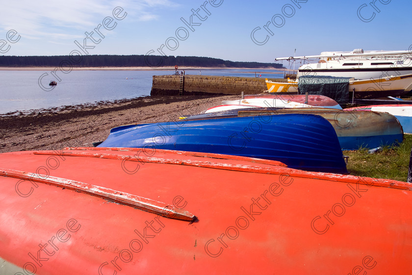 Findhorn Boats UP280355JHP 
 Findhorn Bay Colourful Boat Hulls River Estuary Beached Spring Sunshine north of Morayshire town of Forres on the Moray Firth on the banks of River Findhorn and is a sheltered anchorage for small boats and yachts and famous for its spiritual community and ecovillage. 
 Keywords: Scotland, Scottish, Moray Firth, Grampian, Highlands, Morayshire, Findhorn, river, bay, estuary, spring, landscape, harbour, boats, beached, hulls, painted, colourful, colours