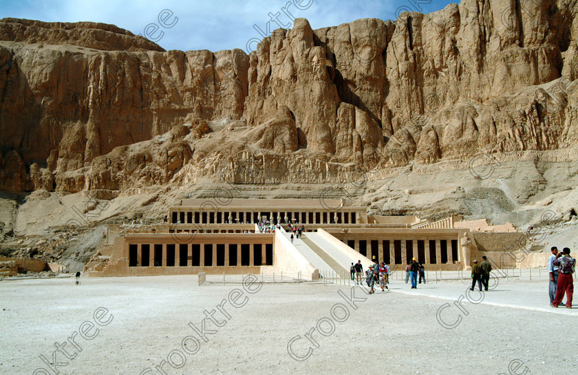 Hatshepsut Temple EG02105JHP 
 Hatshepsut Temple Approach Theban Hill Cliffs ramps Terraces columns Luxor Egypt and the Upper or central court, seen here from the main approach, was opened again in 2002 and makes the visit to this magnificent temple almost complete except that entrance into the burial chamber itself is restricted. This magnificent mortuary temple is located on the West Bank of the River Nile at Luxor at an area called Deir el-Bahri and built into the base of the cliffs of the Theban Hill behind which are branches of the Valley of the Kings. 
 Keywords: Egypt, Luxor, Thebes, Theban, West Bank, Deir el-Bahri, el-Bahari, Dayr, Hatshepsut, mortuary, Temple, landscape, entrance, approach, upper, central, court, statues, archaeology, ancient, Egyptian, history, Egyptology, Consort, Queen, Pharaoh, Royal, ruler, woman, columns, hall