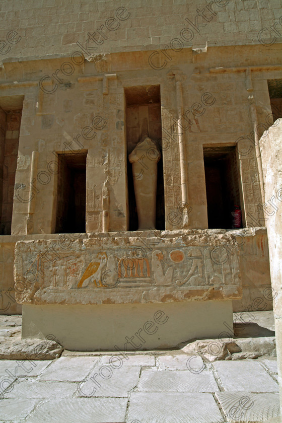 Hatshepsut Temple EG02122JHP 
 Hatshepsut Temple Statue alcove painted relief Horus block limestone Upper central court was opened again in 2002 and makes the visit to this magificent temple almost complete except that entrance into the burial chmaber itself is restricted. This magnificent mortuary temple is located on the West Bank of the River Nile at Luxor at an area called Deir el-Bahri and built into the base of the cliffs of the Theban Hill behind which are branches of the Valley of the Kings. 
 Keywords: Egypt, Luxor, Thebes, Theban, West Bank, Deir el-Bahri, el-Bahari, Dayr, Hatshepsut, mortuary, Temple, upright, upper, central, court, statues, archaeology, ancient, Egyptian, history, Egyptology, Consort, Queen, Pharaoh, Royal, ruler, woman, columns, hall