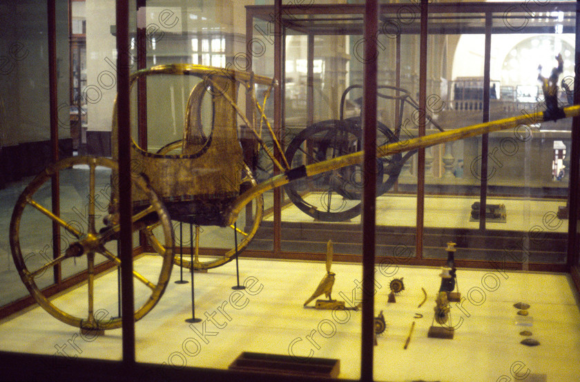 Tut War Chariot EG11722JHP 
 Egyptian Cairo Museum golden ceremonial chariot cabinet photograph Tut Tutankhamun in the prime antiquities collection in Cairo taken during visits between 1994 and 1996 when photography was allowed albeit without flash and tripod. None is of studio quality, being handheld with existing, usually extremely poor light and using slide film, pushed Fuji 400asa to get a suitable aperture and shutter speed. Most of the photos are from the Tutankahum exhibits while the rest are items that interested me as I explored this wonderful and extensive collection, requiring many more hours if not days and is only hinted at during the usual one or two hour visit made on a package tour. 
 Keywords: Egypt, Cairo, Egyptian, Museum, Tutankhamun, chariot, ceremonial, display, Tut, collection, landscape, ancient, antiquity, antiquities, exhibit