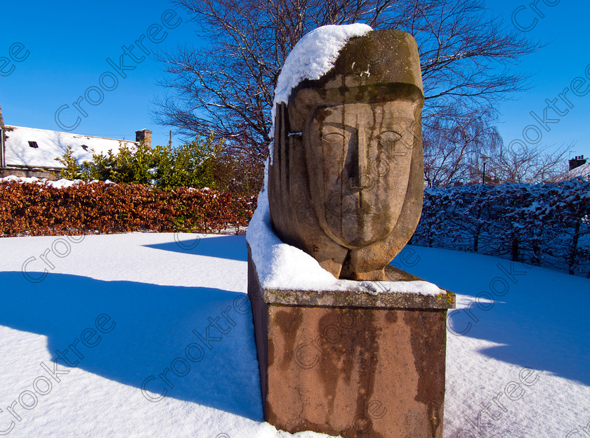 Huntly Sculpture Snow TO173077JHP 
 Sculpture Huntly town park snow Aberdeenshire Scotland situated on River Deveron and with a spectacular Historic Scotland castle in this large town on the main Aberdeen to Inverness route. 
 Keywords: Scotland, Scottish, Grampian, North East, Aberdeenshire, Huntly, town, sculpture, public, park, stone, face, carved, landscape, winter, snow