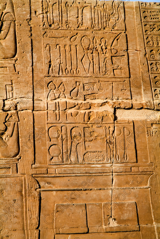 Kom Ombo Instruments Relief EG053175JHP 
 Kom Ombo Ancient Egyptian Temple Medical Instruments Relief Photo Wall Carving some thought to be medical in use on the River Nile just north of Aswan and a regular visit on all Nile Cruises, was principally built by Ptolemy V of Silsilah sandstone. Dedicated to two Gods – Sobek, the crocodile and Horus, the falcon and although it has been damaged over the years, mainly through slipping into the River Nile and some structural damage owing to earthquakes, there are still some wonderful colourful reliefs of the most detailed and delicate style. 
 Keywords: Egypt, East Bank, River Nile, Kom Ombo, Temple, hypostyle hall, pylon, columns, bas reliefs, coloured, colored, colours, colors, Silsilah, sandstone, upright, instruments, medical, hieroglyphs, history, archaeology, ancient, Egyptian, Egyptology, Ptolemaic, carvings, detailed, delicate, beautiful, fine