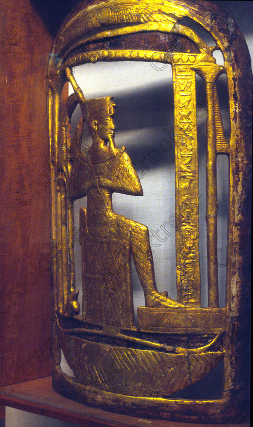Tut Gold Shield EG01263JHP 
 Egyptian Cairo Museum Exhibit votive shields Tomb Tutankhamun Tut annexe in Luxor. In the prime antiquities collection in Cairo taken during visits between 1994 and 2001 when photography was allowed albeit without flash and tripod. None is of studio quality, being handheld with existing, usually extremely poor light and using slide film, pushed Fuji 400asa to get a suitable aperture and shutter speed. Most of the photos are from the Tutankahum exhibits while the rest are items that interested me as I explored this wonderful and extensive collection, requiring many more hours if not days and is only hinted at during the usual one or two hour visit made on a package tour. 
 Keywords: Egypt, Cairo, Egyptian, Museum, Tutankhamun, votive, shield, gilded, wood, ceremonial, throne, Tut, collection, upright, ancient, antiquity, antiquities, exhibit