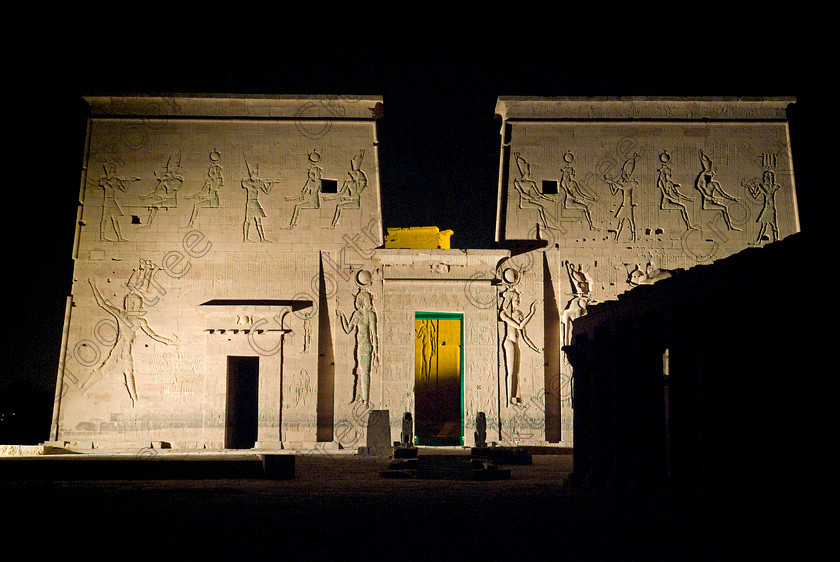 Philae Light Show EG052880JHP 
 Philae Temple Light Show Aswan Island Egypt Pylon First Courtyard Night in which, during the first section, spectators walk through the temple with areas highlighted at each stop but the time to take photographs is limited. The second part of the evening is seated and photography is very easy, a tripod is permitted and necessary for time exposures to be made as flash on cameras is almost pointless and more of a nuisance for other viewers. This Sound & Light Show is perhaps the most spiritual of those shown at other centres especially with the trip at night by boat to the island and the peacefulness that naturally surrounds this location. 
 Keywords: Egypt, Egyptian, Aswan, River Nile, Agilkia Island, island, Philae, temple, light, sound, show, landscape, first, pylon, colonnade, court, entrance, Son, Lumiere, spectacular, fantasy, dramatic, night, dark, stars, colours, colors, colourful, colorful, spiritual, surreal