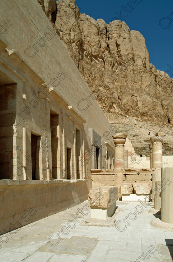 Hatshepsut Temple EG02117JHP 
 Hatshepsut Queen Egyptian Pharaoh Temple Theban Cliff face towering over Upper or central court was opened again in 2002 and makes the visit to this magificent temple almost complete except that entrance into the burial chmaber itself is restricted. This magnificent mortuary temple is located on the West Bank of the River Nile at Luxor at an area called Deir el-Bahri and built into the base of the cliffs of the Theban Hill behind which are branches of the Valley of the Kings. 
 Keywords: Egypt, Luxor, Thebes, Theban, West Bank, Deir el-Bahri, el-Bahari, Dayr, Hatshepsut, mortuary, Temple, upright, upper, central, court, statues, archaeology, ancient, Egyptian, history, Egyptology, Consort, Queen, Pharaoh, Royal, ruler, woman, columns, hall