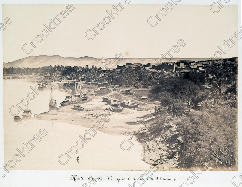 Beato Aswan and River Nile 22JHP05 
 Egypt Aswan Riverbank River Nile Photograph Antonio Beato Albumen Print Victorian photographer around 1890 and this copy is taken from his album called The Nile 1872 long before the modern developments of hotels, highrise apartments, cruiseboat berths and riverside restaurants. 
 Keywords: Egypt, Aswan, Nubia, east bank, River Nile, shoreline, riverbank, water, reflections, boats, feluccas, sailing, houses, mosque, minaret, trees, history, antiquity, Egyptian, ancient, archaeology, Egyptology, landscape, Antonio Beato, Victorian, photographer, earliest, albumen, print, copy