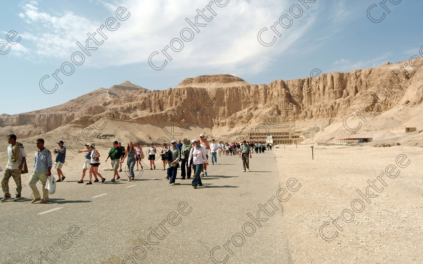 Hatshepsut Walk In EG020102jhp 
 Hatshepsut Temple Luxor Egyptian approach cliffs crowds tourists busy Theban hill was opened again in 2002 and makes the visit to this magnificent temple almost complete except that entrance into the burial chamber itself is restricted. This magnificent mortuary temple is located on the West Bank of the River Nile at Luxor at an area called Deir el-Bahri and built into the base of the cliffs of the Theban Hill behind which are branches of the Valley of the Kings. 
 Keywords: Egypt, Luxor, Thebes, Theban, West Bank, Deir el-Bahri, el-Bahari, Dayr, Hatshepsut, mortuary, Temple, landscape, approach, ramps, crowds, visitors, tourists, upper, archaeology, ancient, Egyptian, history, Egyptology, Consort, Queen, Pharaoh, Royal, ruler, woman, columns, terraces, cliff-face