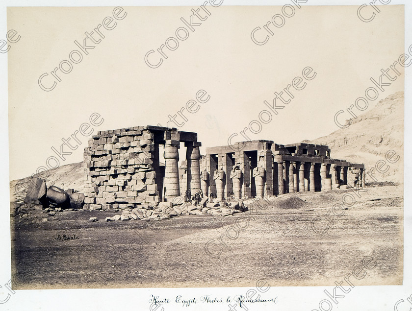 Beato Ramasseum 14JHP05 
 Ramasseum Pylon Fallen Ramasses Hypostyle Hall Beato Old Photograph Albumen Print viewed from south eastern corner near entrance situated on the West Bank of River Nile at Luxor photographed by Antonio Beato, a Victorian photographer around 1890 and this copy is taken from his album called The Nile 1872. It is little changed from the modern situation as seen in identical viewpoints in the Ramasseum Gallery. 
 Keywords: Egypt, Luxor, Ramasseum, Temple, Thebes, River Nile, ancient, archaeology, ancient, Egyptian, Egyptology, Ramses 11, Ramasses, Ramesses, Osiride, Antonio Beato, Victorian, 1890, photographer, albumen, print, copy, old, photos, earliest, Belzoni, Shelley, Ozymandias, colossus, torso, pylon