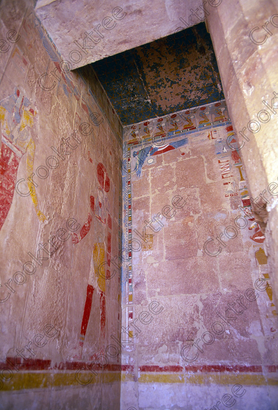 Hatshepsut Luxor EG206410jhp 
 Hatshepsut Temple painted walls Horus Queen colours food Egypt west bank Luxor in one of the lower levels and the upper courtyard was opened again in 2002 and makes the visit to this magnificent temple almost complete except that entrance into the burial chamber itself is restricted. This magnificent mortuary temple is located on the West Bank of the River Nile at Luxor at an area called Deir el-Bahri and built into the base of the cliffs of the Theban Hill behind which are branches of the Valley of the Kings. Hatshepsut Temple decorations are still colourful and unlike most are accessible for photographing and lit by natural light. 
 Keywords: Egypt, Luxor, Thebes, Theban, West Bank, Deir el-Bahri, el-Bahari, Dayr, Hatshepsut, mortuary, Temple, colonnade, terraces, landscape, upright, archaeology, ancient, Egyptian, history, Egyptology, Consort, Queen, Pharaoh, Royal, ruler, woman, wall, painting, offering, Anubis, Amun, food, drink, wine, ducks, meat, fruit, flowers, colourful, colorful, colours, colors, hieroglyphs, stars, ceiling, 2000, July, summer, 35mm, slide, film, Velvia, RVP, scanned, scan, camera, Nikon, FM2