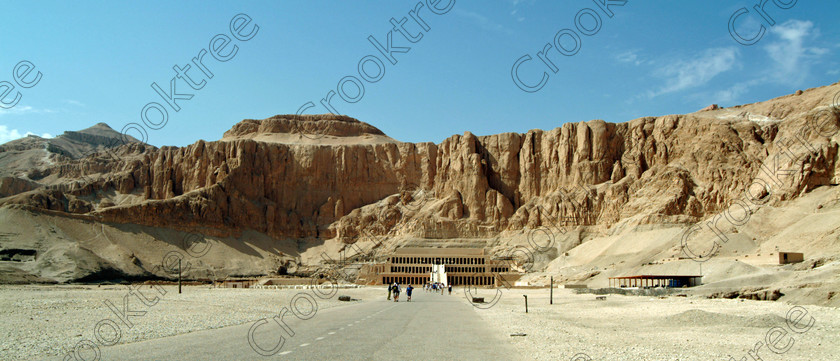 Hatshepsut Temple EG02141JHP 
 Hatshepsut Ancient Egyptian Temple Vista panorama approach walk Theban hill cliffs Upper or central court was opened again in 2002 and makes the visit to this magificent temple almost complete except that entrance into the burial chmaber itself is restricted. This panoramic view on the main approach reinforces how this magnificent mortuary temple is located on the West Bank of the River Nile at Luxor at an area called Deir el-Bahri and built into the base of the cliffs of the Theban Hill summit to the left and behind are branches of the Valley of the Kings. 
 Keywords: Egypt, Luxor, Thebes, Theban, hill, summit, West Bank, Deir el-Bahri, el-Bahari, Dayr, Hatshepsut, mortuary, Temple, panorama, upper, central, court, statues, archaeology, ancient, Egyptian, history, Egyptology, Consort, Queen, Pharaoh, Royal, ruler, woman, columns
