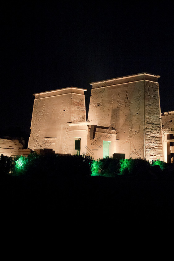 Philae Light Show EG052904JHP 
 Philae Temple Pylon Night Dark Sound Son Lumiere Light Show Aswan in which, during the first section, spectators walk through the temple with areas highlighted at each stop but the time to take photographs is limited. The second part of the evening is seated and photography is very easy, a tripod is permitted and necessary for time exposures to be made as flash on cameras is almost pointless and more of a nuisance for other viewers. This Sound & Light Show is perhaps the most spiritual of those shown at other centres especially with the trip at night by boat to the island and the peacefulness that naturally surrounds this location. 
 Keywords: Egypt, Egyptian, Aswan, River Nile, Agilkia Island, island, Philae, temple, light, sound, show, landscape, upright, pylons, colonnade, court, entrance, Son, Lumiere, spectacular, fantasy, dramatic, night, dark, stars, colours, colors, colourful, colorful, spiritual, surreal