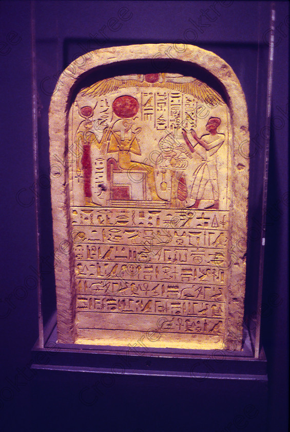 Luxor Horus Stele EG9620915JHP 
 Egypt Museum Luxor Exhibit Stele Stela Painted Hathor Horus Photograph was taken inside this modern building on the waterfront of the River Nile with its fascinating collection covering the extensive history of ancient Egypt including items from the Tomb of Tutankahum. This particular exhibit is in the museum proper and was taken in 1996 when you could pay to take photographs but not use a tripod, now not allowed at all, and I used Kodak 5042 Tungsten Slide film which still meant hand holding was at the extremes of useful photography in low light conditions. 
 Keywords: Egypt, Egyptian, Luxor, East, Bank, River, Nile, Museum, Interior, upright, stele, stela, painted, colourful, Hathor, Horus, hieroglyphs, history, archaeology, Egyptology, exhibit