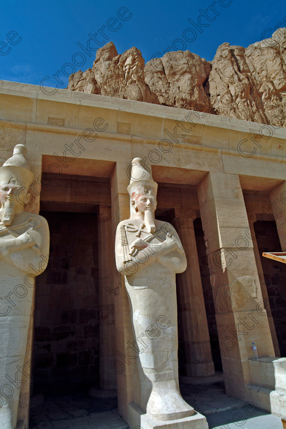 Hatshepsut Temple EG02107JHP 
 Hatshepsut Egyptian Queen Pharaoh Osiride Figures Carved statues Terrace Temple Upper or central court was opened again in 2002 and makes the visit to this magnificent temple almost complete except that entrance into the burial chamber itself is restricted. This magnificent mortuary temple is located on the West Bank of the River Nile at Luxor at an area called Deir el-Bahri and built into the base of the cliffs of the Theban Hill behind which are branches of the Valley of the Kings. 
 Keywords: Egypt, Luxor, Thebes, Theban, West Bank, Deir el-Bahri, el-Bahari, Dayr, Hatshepsut, mortuary, Temple, upright, upper, central, court, statues, archaeology, ancient, Egyptian, history, Egyptology, Consort, Queen, Pharaoh, Royal, ruler, woman, columns, hall