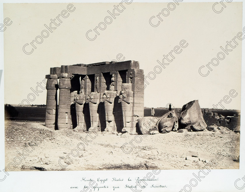 Beato Ramasseum 05JHP05 
 Ramasseum Pylon Fallen Egyptian Ramesses Beato Old Photograph Albumen situated on the wast Bank of River Nile at Luxor photographed by Antonio Beato, a Victorian photographer around 1890 and this copy is taken from his album called The Nile 1872. It is little changed from the modern situation as seen in identical viewpoints in the Ramasseum Gallery. 
 Keywords: Egypt, Luxor, Ramasseum, Temple, Thebes, River Nile, ancient, archaeology, ancient, Egyptian, Egyptology, Ramses 11, Ramasses, Ramesses, Osiride, Antonio Beato, Victorian, 1890, photographer, albumen, print, copy, old, photos, earliest, Belzoni, Shelley, Ozymandias, colossus, torso, pylon