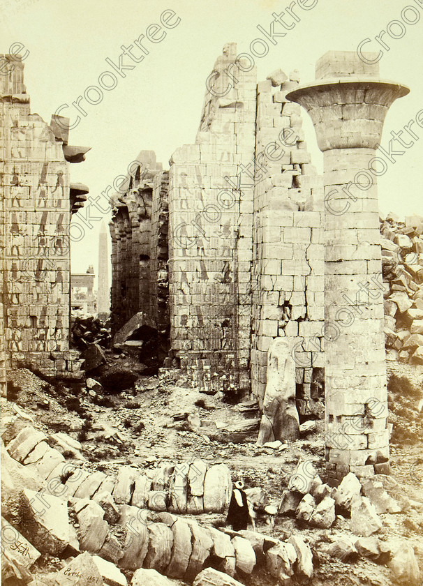 Frith Karnak Temple 8392VQJHP 
 Karnak Temple Hypostyle Hall Taharka Kiosk Frith Old Photo Albumen Print Egypt located near Luxor City centre on the East Bank of the River Nile and it is the largest religious complex on the Nile. Here showing the fallen columns of Taharqa's Kiosk, the the one remaining one standing, as it does today and beyond the large columns of the hypostyle hall. The photo was taken by Francis Frith, an English Victorian photographer and dated 1857. 
 Keywords: Egypt, Luxor, Thebes, River Nile, East Bank, Karnak Temple, Taharqa, upright, kiosk, fallen, columns, hypostyle hall, obelisk, ancient, history, archaeology, ancient, Egyptian, Egyptology, Francis Frith, English, Victorian, 1887, photographer, albumen, copy, print