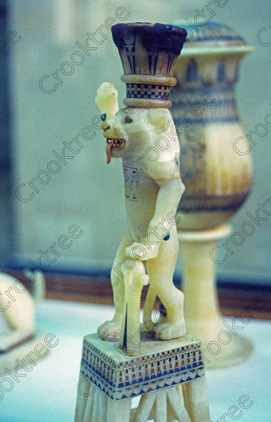 Tut Unguent Lion EG11714JHP 
 Egyptian Museum Interior alabaster unguent vase lion burial good Tutankhamun Tomb in the prime antiquities collection in Cairo taken during visits between 1994 and 1996 when photography was allowed albeit without flash and tripod. None is of studio quality, being handheld with existing, usually extremely poor light and using slide film, pushed Fuji 400asa to get a suitable aperture and shutter speed. Most of the photos are from the Tutankahum exhibits while the rest are items that interested me as I explored this wonderful and extensive collection, requiring many more hours if not days and is only hinted at during the usual one or two hour visit made on a package tour. 
 Keywords: Egypt, Cairo, Egyptian, Museum, Tutankhamun, unguent, alabaster, vase, lion, ankh, tongue, coloured, Tut, collection, upright, ancient, antiquity, antiquities, exhibit