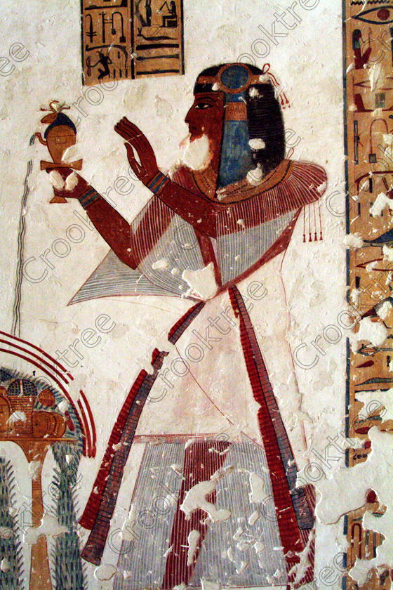 Valley Kings EG0213039jhp 
 Egypt Valley Kings Tomb KV19 Prince Mentuherkhepshef painting offering colours was son of Ramasses 1X, although his tomb was unfinished it has some excellent colourful depictions of the important ancient Egyptian Gods and although protected by Perspex panels, the custodian was very helpful and slid them back for me to take photographs in 2002 when it was still allowed. Thanks to the capability of the modern digital camera, the first and only chance I have had to use one, a Fuji S2 as photography is now banned in the Valley of Kings per se and especially in the tombs. Adjustments in Photoshop give the chance of reasonably accurate colours even when the tomb paintings were lit by low level artificial light when tripods and flash were not allowed; what could I get with a Nikon F700 and a tripod, which were allowed at one time as well. 
 Keywords: Egypt, Luxor, West Bank, Thebes, Theban, Valley Kings, prince, tomb, KV19, Montu, Mentuherkhepshef, Montu-hir-Khopshef, upright, paintings, colourful, colorful, colours, colors, bright, white, plaster, ancient, Egyptian, archaeology, Egyptology, hieroglyphs, death, burial, mythology, afterlife, history, hieroglyphics, Gods, offering, wine, pouring, fruit, flowers, wine, grapes, bread, DSLR, Fuji, S2, handheld, artificial, light, Photoshop, adjusted, corrections, Perspex, screens