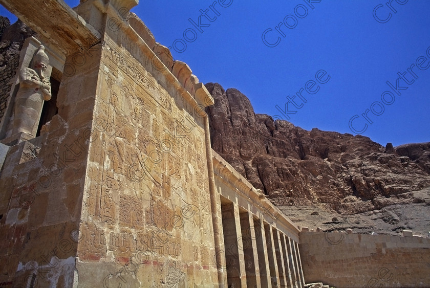 Hatshepsut Luxor EG206420jhp 
 Hatshepsut Temple Hathor Chapel Osiride statue Queen Egypt second colonnade in benath the upper courtyard which was opened again in 2002 and makes the visit to this magnificent temple almost complete except that entrance into the burial chamber itself is restricted. This magnificent mortuary temple is located on the West Bank of the River Nile at Luxor at an area called Deir el-Bahri and built into the base of the cliffs of the Theban Hill behind which are branches of the Valley of the Kings.
Hatshepsut Temple decorations are still colourful and unlike most are accessible for photographing and lit by natural light. 
 Keywords: Egypt, Luxor, Thebes, Theban, West Bank, Deir el-Bahri, el-Bahari, Dayr, Hatshepsut, mortuary, Temple, second, colonnade, terraces, rock, cliffs, rockface, Hathor, Chapel, landscape, archaeology, ancient, Egyptian, history, Egyptology, Consort, Queen, Pharaoh, Royal, ruler, woman, wall, painting, colourful, colorful, colours, colors, 2000, July, summer, 35mm, slide, film, Velvia, RVP, scanned, scan, camera, Nikon, FM2