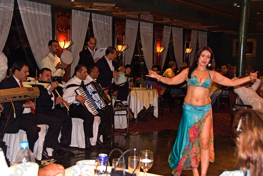 Cairo Cruiseboat Belly Dancer 7023EG07JHP 
 Cairo Nile cruise boat belly dancer show evening package Egyptian tour on offer during a visit to Cairo is an evening dinner with traditional music and dancing as entertainment on a River Nile cruiseboat cruising past the city lights and major riverside commercial buildings and offices. 
 Keywords: Egypt, Egyptian, River Nile, Cairo, holiday, cruiseboat, upright, entertainment, package, tourists, tourism, colours, colors, colourful, colorful, dancing, dinner, food, eating, clapping, music, musicians, belly, dancer, woman