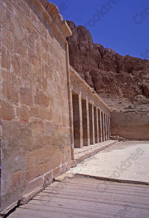 Hatshepsut Luxor EG206419jhp 
 Hatshepsut Temple second Hathor terrace cow cliffs frontage Egypt Luxor on one of the lower levels and the upper courtyard was opened again in 2002 and makes the visit to this magnificent temple almost complete except that entrance into the burial chamber itself is restricted. This magnificent mortuary temple is located on the West Bank of the River Nile at Luxor at an area called Deir el-Bahri and built into the base of the cliffs of the Theban Hill behind which are branches of the Valley of the Kings.
Hatshepsut Temple decorations are still colourful and unlike most are accessible for photographing and lit by natural light. 
 Keywords: Egypt, Luxor, Thebes, Theban, West Bank, Deir el-Bahri, el-Bahari, Dayr, Hatshepsut, mortuary, Temple, second, colonnade, terraces, rock, cliffs, rockface, Hathor, Chapel, landscape, upright, archaeology, ancient, Egyptian, history, Egyptology, Consort, Queen, Pharaoh, Royal, ruler, woman, wall, painting, colourful, colorful, colours, colors, 2000, July, summer, 35mm, slide, film, Velvia, RVP, scanned, scan, camera, Nikon, FM2