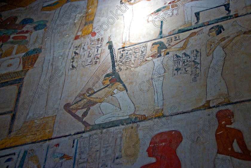 Rekhmire Tomb Painting EG075692JHP 
 Egyptian Rekhmire Tomb Painting Musicians Harp Women Interior Photo Luxor, one of many beautiful tomb decorations amongst the Tombs of the Nobles on the West Bank of the River Nile at Luxor. Rekhmire Tomb-Chapel [Tomb 100] was a Vizier during the reigns of Tuthmosis 11 and Amenhotep 11, part of a family with long service as administrators at Thebes. This highly decorated cruciform tomb is full images giving great understanding of Egyptian foreign policy, taxation and the justice system. The area around the Tombs has now been greatly improved with removal of many of the old modern houses and entry to these fascinating burial sites made more accessible. 
 Keywords: Egypt, Egyptian, ancient, Luxor, Tombs, Nobles, Thebes, River Nile, West Bank, Old Qurna, Sheikh Abd’el-Qurna, landscape, Rekhmire, Vizier, administrator, tomb, painting, dancers, musicians, harp, hieroglyphs, colourful, colorful, colours, colors, painted, artificial, light, digital
