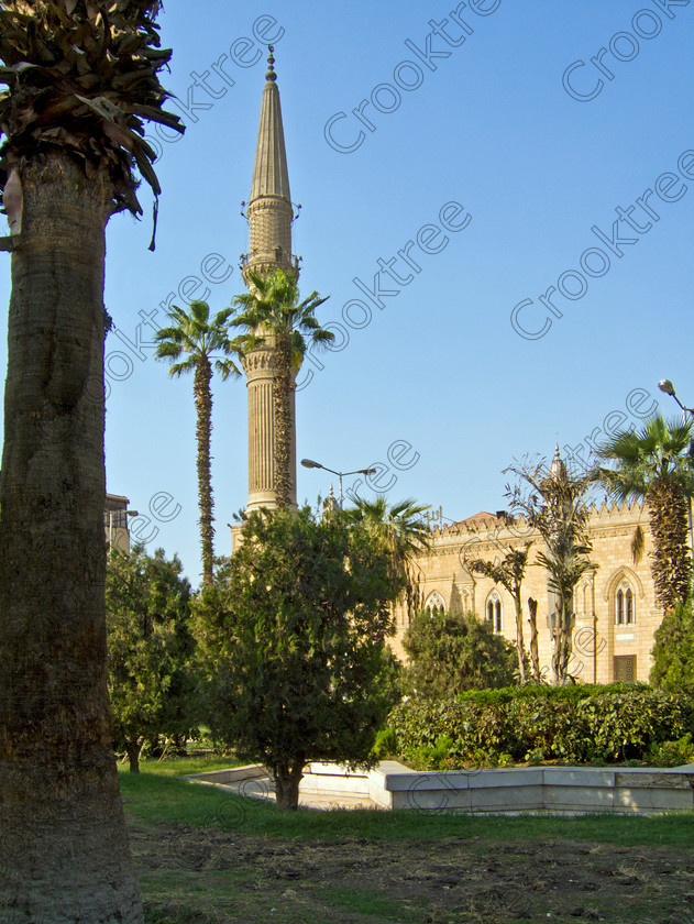Cairo Mosque EG072611jhp 
 Egypt Cairo mosque minaret Sayyidna al-Husayn square trees plants Maydan near the busy and often important site of Kan al-khalili a popular stop-off for tourists to Egypt and offered as part of City Tour where many bargains can be picked up as part of that exotic shopping experience in an Arabic Bazaar. Bargaining is also part of the fun and is expected throughout so a new and often daunting experience for the traditional conservative British visitor. Better value can probably be obtained in Aswan or Luxor and certainly for those doing a Nile Cruise large, weighty or fragile items are best left to the last minute. 
 Keywords: Egypt, Egyptians, Cairo, cruise Arabic, bargaining, tourism, tourists, upright, capital, old, city, gates, Sultan, Qansuh, Fatimid, Kan al-Khalili, al-Kalili, souk, al-Badestan, maze, alleyways, alleys, shops, factories, bazaars, market, antiques, gold, jewellery, clothes, glass, leather, metal, wood, crafts, souvenirs, cafes, restaurants, sheeshas, trade, commercial, mosques, minaret, palm, trees, architecture, al-Azhar, Maydan, square, al-Hussein, Sayyidna, al-Husayn, building, 19C, Gothic