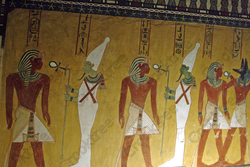 Valley Kings EG0213058jhp 
 Egypt Valley Kings Luxor Thutmosis 1V Tomb KV43 Osiris painting antechmaber in the Valley of the Kings on the West Bank of the River Nile at Luxor which was robbed in antiquity and later restored by Horemheb through his official Maya. In the Tomb-Chamber is a red granite sarcophagus with still very brilliant colourful decoration as illustrated in the photo of the Goddess Nephthys.
Thanks to the capability of the modern digital camera and adjustments in Photoshop reasonably accurate colours can be exhibited of tomb paintings lit by low level artificial light when tripods and flash are not allowed such as the head of Anubis. This was taken before the current ban on tomb photography was introduced when you could purchase a ticket to photograph in two tombs in 2002. Unfortunately most of the photos of the painting had to be taken through Perspex which diminishes their quality as it obvious in several cases. 
 Keywords: Egypt, Luxor, West Bank, Thebes, Theban, Valley Kings, pharaoh, Tuthmosis, Thutmose, 1V, tomb, KV43, landscape, Osiris, Anubis, Hathor, jackal, head, painting, colourful, colorful, colours, colors, black, yellow, white, necklace, bright, ancient, Egyptian, archaeology, Egyptology, hieroglyphics, hieratic, writing, Maya, restoration, text, death, burial, Nut, nightsky, mythology, afterlife, sarcophagus, Nephthys, out-stretched, granite, chamber, antechamber, interiors, austere, undecorated, columns, stars, ceiling, history, hieroglyphs