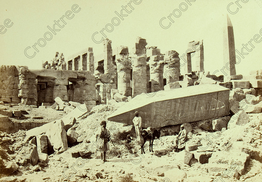 Frith Karnak Temple 8405VQJHP 
 Karnak Temple Hypostyle Hall Fallen Obelisk Frith Old Photo Albumen Print located near Luxor City centre on the East Bank of the River Nile and it is the largest religious complex on the Nile. Here showing the fallen obelisk top of Hatshepsut's southern one; the northern still stands and beyond the large columns of the hypostyle hall. The photo was taken by Francis Frith, an English Victorian photographer and dated 1887. 
 Keywords: Egypt, Luxor, Thebes, River Nile, East Bank, Karnak Temple, obelisk, Hatshesput, south, pyramidion, fallen, hypostyle hall, columns, ancient, history, archaeology, ancient, Egyptian, Egyptology, Francis Frith, English, Victorian, 1887, photographer, albumen, copy, print