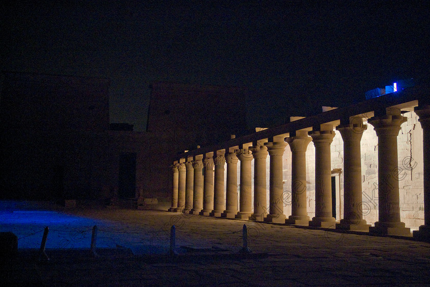 Philae Light Show EG052874JHP 
 Philae Temple Sound Light Show East Colonnade Litup Highlighted Columns Aswan in which, during the first section, spectators walk through the temple with areas highlighted at each stop but the time to take photographs is limited. The second part of the evening is seated and photography is very easy, a tripod is permitted and necessary for time exposures to be made as flash on cameras is almost pointless and more of a nuisance for other viewers. This Sound & Light Show is perhaps the most spiritual of those shown at other centres especially with the trip at night by boat to the island and the peacefulness that naturally surrounds this location. 
 Keywords: Egypt, Egyptian, Aswan, River Nile, Agilkia Island, Philae, temple, island, light, sound, show, landscape, colonnade, eastern, court, entrance, Son, Lumiere, spectacular, fantasy, dramatic, night, dark, stars, colours, colors, colourful, colorful, spiritual, surreal