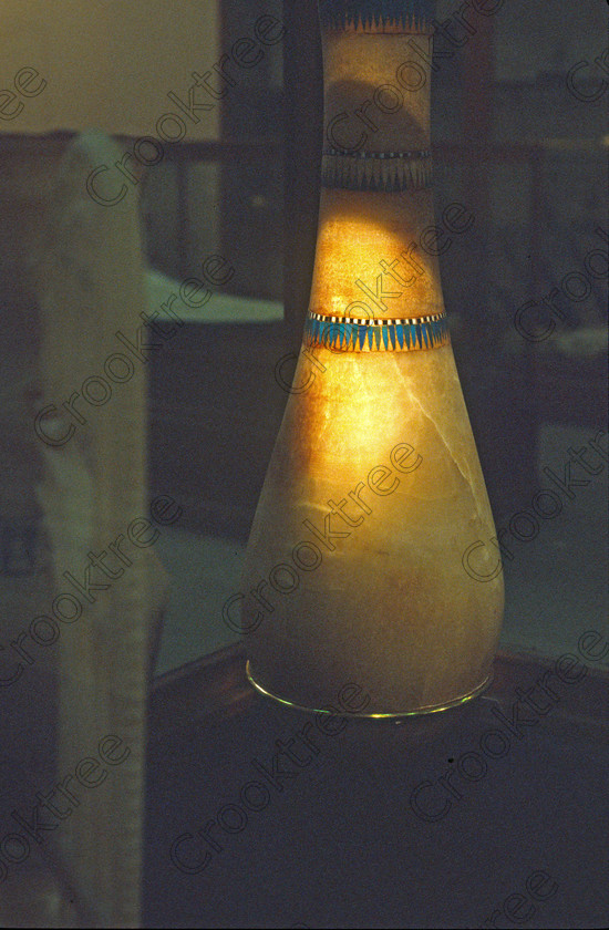 Tut Alabaster Vase EG012612JHP 
 Egyptian Museum Exhibit alabaster vase floral collar smooth shapely Tutankahum discovery in the prime antiquities collection in Cairo taken during visits between 1994 and 1996 when photography was allowed albeit without flash and tripod. None is of studio quality, being handheld with existing, usually extremely poor light and using slide film, pushed Fuji 400asa to get a suitable aperture and shutter speed. Most of the photos are from the Tutankahum exhibits while the rest are items that interested me as I explored this wonderful and extensive collection, requiring many more hours if not days and is only hinted at during the usual one or two hour visit made on a package tour. 
 Keywords: Egypt, Cairo, Egyptian, Museum, Tutankhamun, Tut, collection, alabaster, vase, coloured, colored, upright, ancient, antiquity, antiquities, exhibit