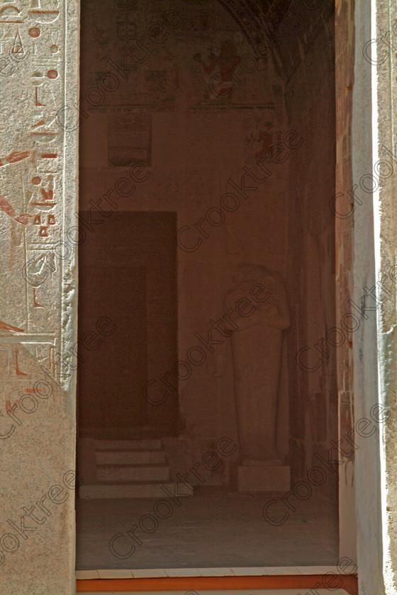 Hatshepsut Temple EG02128JHP 
 Hatshepsut Recent Excavation Egypt Temple Sanctuary Amun Entrance Upper central court was opened again in 2002 and makes the visit to this magificent temple almost complete except that entrance into the burial chamber itself is restricted; using a telephoto les this was the best sneeky look I could get. This magnificent mortuary temple is located on the West Bank of the River Nile at Luxor at an area called Deir el-Bahri and built into the base of the cliffs of the Theban Hill behind which are branches of the Valley of the Kings. 
 Keywords: Egypt, Luxor, Thebes, Theban, West Bank, Deir el-Bahri, el-Bahari, Dayr, Hatshepsut, mortuary, Temple, upright, upper, central, burial, chamber, doorway, entrance, statue, archaeology, ancient, Egyptian, history, Egyptology, Consort, Queen, Pharaoh, Royal, ruler, woman, columns, hall