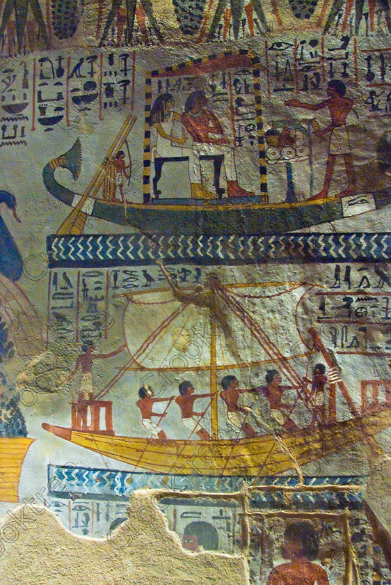 Sennefer Tomb Painting EG075667JHP 
 Sennefer Tomb Painting Wall Boats Sailing Oarsmen Colours Luxor Egypt, one of many beautiful tomb decorations amongst the Tombs of the Nobles on the West Bank of the River Nile at Luxor. Sennefer [Tomb 96] was Major of the Southern City in Dynasty XV111 during the reign of Amenhotep 11. The area has been greatly improved with removal of many of the old modern houses and entry to these fascinating burial sites made more accessible. 
 Keywords: Egypt, Luxor, Tombs, Nobles, Thebes, River Nile, West Bank, Old Qurna, Sheikh Abd’el-Qurna, upright, Mayor, Sennefer, tomb, painting, colourful, colorful, colours, colors, painted, boats, sailing, oarsmen, water, frieze, vines, grapes, artificial, light, digital