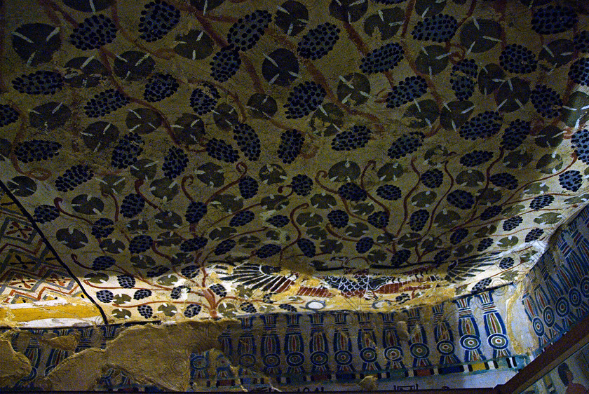 Sennufer Tomb Ceiling EG075670JHP 
 Ancient Egyptian Luxor Noble Sennefer Tomb Painted Ceiling Flowers Colours, one of many beautifully decorated tombs amongst the Tombs of the Nobles on the West Bank of the River Nile at Luxor. Sennefer [Tomb 96] was Major of the Southern City in Dynasty XV111 during the reign of Amenhotep 11 and this photo is of the almost complete ceiling although the lighting is rather unbalanced for non-flash photography. The area has been greatly improved with removal of many of the old modern houses and entry to these fascinating burial sites made more accessible. 
 Keywords: Egypt, Luxor, Tombs, Nobles, Thebes, River Nile, West Bank, Old Qurna, Sheikh Abd’el-Qurna, landscape, Mayor, Sennefer, tomb, painting, colourful, colorful, colours, colors, painted, ceiling, frieze, vines, grapes, artificial, light, digital