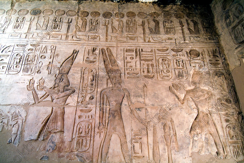 Seti 1 Temple EG053348JHP 
 Temple Seti Wall Relief God Amun Scepter Painted Hieroglyphs Cartouche on the West Bank of the River Nile at Luxor in an area called al-Tarif turning off eastwards instead of taking the Valley of the Kings road. Attributed to Seti it had involvement by Ramasses 1 and 11 and with recent restoration is a delightful extra addition should you have free time while in Luxor and described in the early days as Goorneh Temple. 
 Keywords: Egypt, Luxor, Thebes, River Nile, West Bank, Tarif, village, Temple, Sethos, Seti, Sety, Ramses, mortuary, Dra Abu el-Naga, Qurna, Goorneh, landscape, Amun, offering, ankh, was sceptre, necropolis, sandstone, wall, reliefs, bas, painted, coloured, colours, colors, history, archaeology, ancient, Egyptian, Egyptology, decorated