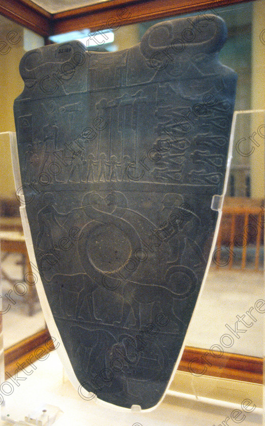 Narmer Tablet EG11832JHP 
 Egyptian Museum Cairo Narmer Tablet carved earliest Egypt dating Dynasty 0 around 3000BC in the prime antiquities collection in Cairo taken during visits between 1994 and 1996 when photography was allowed albeit without flash and tripod. None is of studio quality, being handheld with existing, usually extremely poor light and using slide film, pushed Fuji 400asa to get a suitable aperture and shutter speed. Most of the photos are from the Tutankahum exhibits while the rest are items that interested me as I explored this wonderful and extensive collection, requiring many more hours if not days and is only hinted at during the usual one or two hour visit made on a package tour. 
 Keywords: Egypt, Cairo, Egyptian, Museum, collection, Narmer, Palette, Tablet, entwined, cats, necks, vanished, unification, upright, ancient, antiquity, antiquities, exhibit