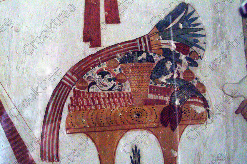 Valley Kings EG0213048jhp 
 Egypt Tomb Mentuherkhepshef painting offering food feast details colors was son of Ramasses 1X, but his tomb was unfinished but has some excellent colourful depictions of the important ancient Egyptian Gods and although protected by Perspex panels, the custodian was very helpful and slid them back for me to take photographs in 2002 when it was still allowed. Thanks to the capability of the modern digital camera, the first and only chance I have had to use one, a Fuji S2 as photography is now banned in the Valley of Kings per se and especially in the tombs. Adjustments in Photoshop give the chance of reasonably accurate colours even when the tomb paintings were lit by low level artificial light when tripods and flash were not allowed; what could I get with a Nikon F700 and a tripod, which were allowed at one time as well. 
 Keywords: Egypt, Luxor, West Bank, Thebes, Theban, Valley Kings, prince, tomb, KV19, Montu, Mentuherkhepshef, Montu-hir-Khopshef, landscape, painting, table, feast, Lotus, flower, fowl, colourful, colorful, colours, colors, bright, white, plaster, ancient, Egyptian, archaeology, Egyptology, hieroglyphics, death, burial, mythology, afterlife, history, hieroglyphs, Gods, offering, fruit, flowers, wine, grapes, bread, DSLR, Fuji, S2, handheld, artificial, light, Photoshop, adjusted, corrections, Perspex, screens