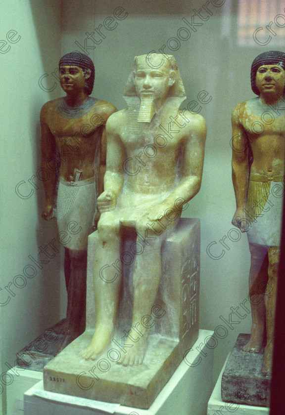 Pharaoh Menkaure EG11820JHP 
 Egyptian Cairo Museum alabaster statue Pharaoh Menkaure ground floor photo in the prime antiquities collection in Cairo taken during visits between 1994 and 1996 when photography was allowed albeit without flash and tripod. None is of studio quality, being handheld with existing, usually extremely poor light and using slide film, pushed Fuji 400asa to get a suitable aperture and shutter speed. Most of the photos are from the Tutankahum exhibits while the rest are items that interested me as I explored this wonderful and extensive collection, requiring many more hours if not days and is only hinted at during the usual one or two hour visit made on a package tour. 
 Keywords: Egypt, Cairo, Egyptian, Museum, collection, ground, floor, alabaster, statue, Menkaure, pharaoh, upright, ancient, antiquity, antiquities, exhibit