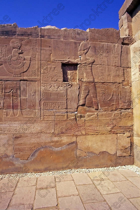 Seti 1 Luxor EG20667jhp 
 Luxor Egypt Temple Sety Wall raised relief Carving Barque Feast Offering on the West Bank of the River Nile at Luxor in an area called al-Tarif turning off eastwards instead of taking the Valley of the Kings road. Attributed to Seti it had involvement by Ramasses 1 and 11 and with recent restoration is a delightful extra addition should you have free time while in Luxor and described in the early days as Goorneh Temple 
 Keywords: Egypt, Luxor, Thebes, River Nile, West Bank, Tarif, village, Temple, Sethos, Seti, Sety, Ramses, mortuary, Dra Abu el-Naga, Qurna, Goorneh, landscape, upright, interior, sandstone, wall, reliefs, bas, offering, Amun, Horus, Mut, desecration, damage, painted, hieroglyphs, cartouche, coloured, colours, colors, history, archaeology, ancient, Egyptian, Egyptology, decorated, barque, feast, offering, Amun, stele, Horus, Mut, bas, 2000, July, summer, 35mm, slide, film, Velvia, RVP, scanned, scan, camera, Nikon, FM2