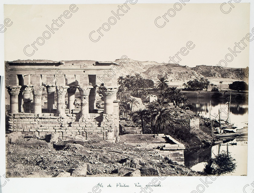 Beato Philae Temple 19JHP05 
 Philae Temple Trajan Kiosk Original Island River Nile Old Photo Beato Albumen Print, dedicated to the Goddess Isis and here photographed by Antonio Beato, a Victorian photographer around 1890 and this copy is taken from his album called The Nile 1872. The large kiosk to the left is that of Trajan and often referred to as Pharaohs Bed; this high viewpoint is not possible today. 
 Keywords: Egypt, Aswan, Nubia, River Nile, Philae, Temple, Island, Trajan, kiosk, Pharaoh's bed, water, history, antiquity, Egyptian, ancient, archaeology, Egyptology, landscape, Antonio Beato, Victorian, photographer, earliest, albumen, print, copy