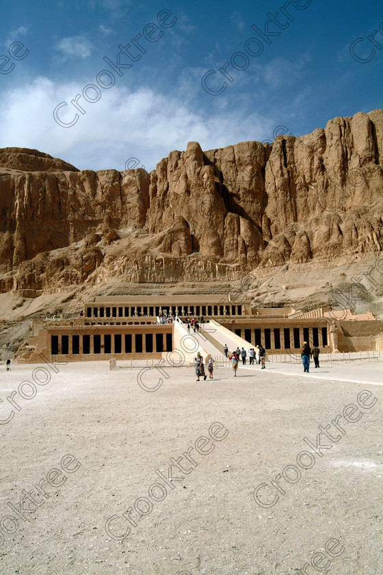 Hatshepsut Temple EG02106JHP 
 Hatshepsut Temple Approach Vista Theban Cliffs Hill backdrop ramps terraces Upper or central court, seen here from the approach, was opened again in 2002 and makes the visit to this magnificent temple almost complete except that entrance into the burial chamber itself is restricted. This magnificent mortuary temple is located on the West Bank of the River Nile at Luxor at an area called Deir el-Bahri and built into the base of the cliffs of the Theban Hill behind which are branches of the Valley of the Kings. 
 Keywords: Egypt, Luxor, Thebes, Theban, West Bank, Deir el-Bahri, el-Bahari, Dayr, Hatshepsut, mortuary, Temple, upright, entrance, approach, upper, central, court, statues, archaeology, ancient, Egyptian, history, Egyptology, Consort, Queen, Pharaoh, Royal, ruler, woman, columns, hall