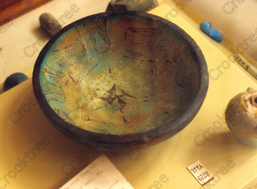 Faience Bowl EG012620JHP 
 Egypt Cairo Museum Exhibit pottery faience bowl painted patterns in the prime antiquities collection in Cairo taken during visits between 1994 and 2001 when photography was allowed albeit without flash and tripod. None is of studio quality, being handheld with existing, usually extremely poor light and using slide film, pushed Fuji 400asa to get a suitable aperture and shutter speed. Most of the photos are from the Tutankahum exhibits while the rest are items that interested me as I explored this wonderful and extensive collection, requiring many more hours if not days and is only hinted at during the usual one or two hour visit made on a package tour. 
 Keywords: Egypt, Cairo, Egyptian, Museum, collection, faience, bowl, landscape, ancient, antiquity, antiquities, exhibit
