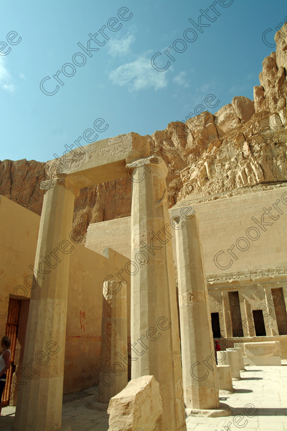 Hatshepsut Temple EG02109JHP 
 Hatshepsut Temple Gateway columns Theban Hills cliffs background Upper central court which was opened again in 2002 and makes the visit to this magnificent temple almost complete except that entrance into the burial chamber itself is restricted. This magnificent mortuary temple is located on the West Bank of the River Nile at Luxor at an area called Deir el-Bahri and built into the base of the cliffs of the Theban Hill behind which are branches of the Valley of the Kings. 
 Keywords: Egypt, Luxor, Thebes, Theban, West Bank, Deir el-Bahri, el-Bahari, Dayr, Hatshepsut, mortuary, Temple, upright, upper, central, court, statues, archaeology, ancient, Egyptian, history, Egyptology, Consort, Queen, Pharaoh, Royal, ruler, woman, columns, hall